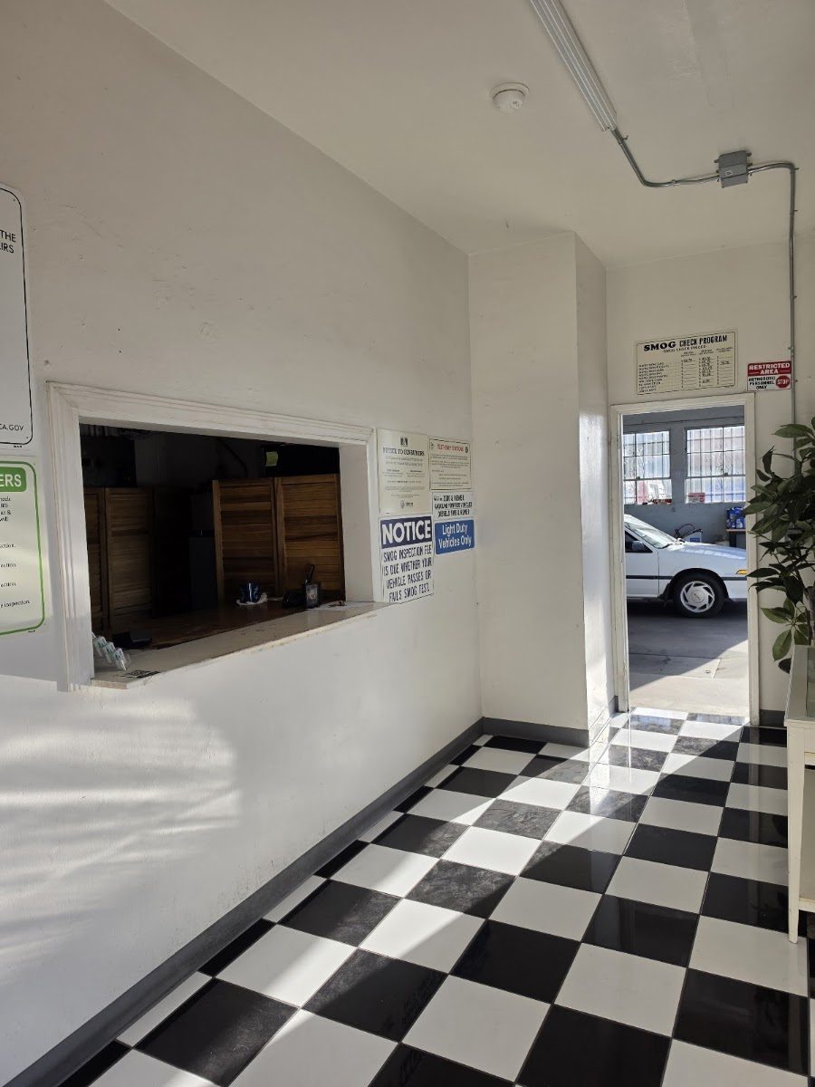 The customer service window and checkerboard hallway leading to the test bay
